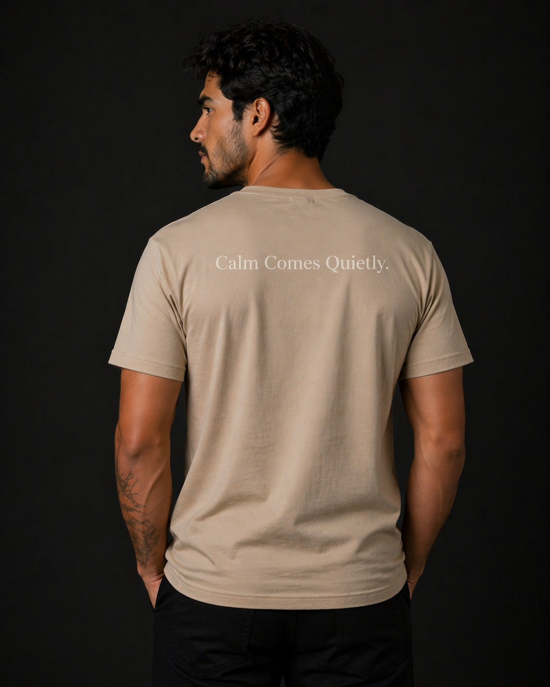 man wearing quiet tide tan calm statement tee back calm comes quietly text