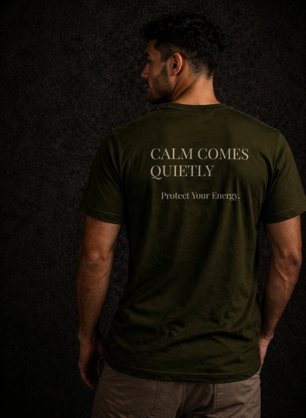 Back view of olive Quiet Tide t-shirt with ‘Calm Comes Quietly’ and ‘Protect Your Energy’ text