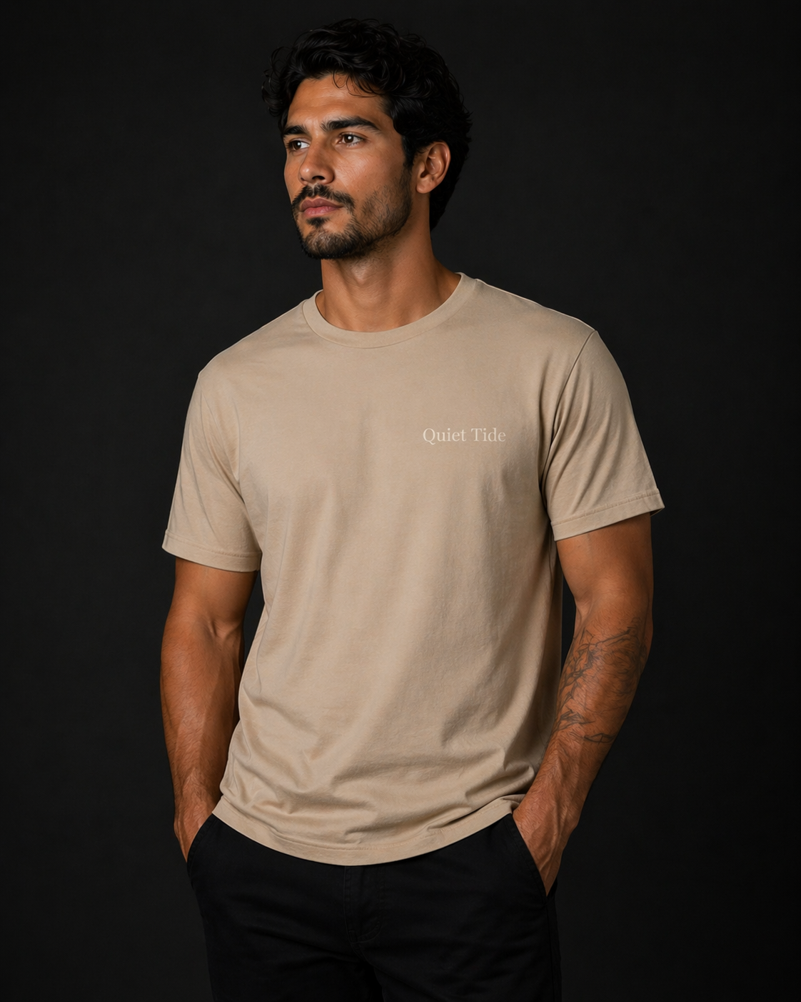 man wearing quiet tide tan calm statement tee front view black background